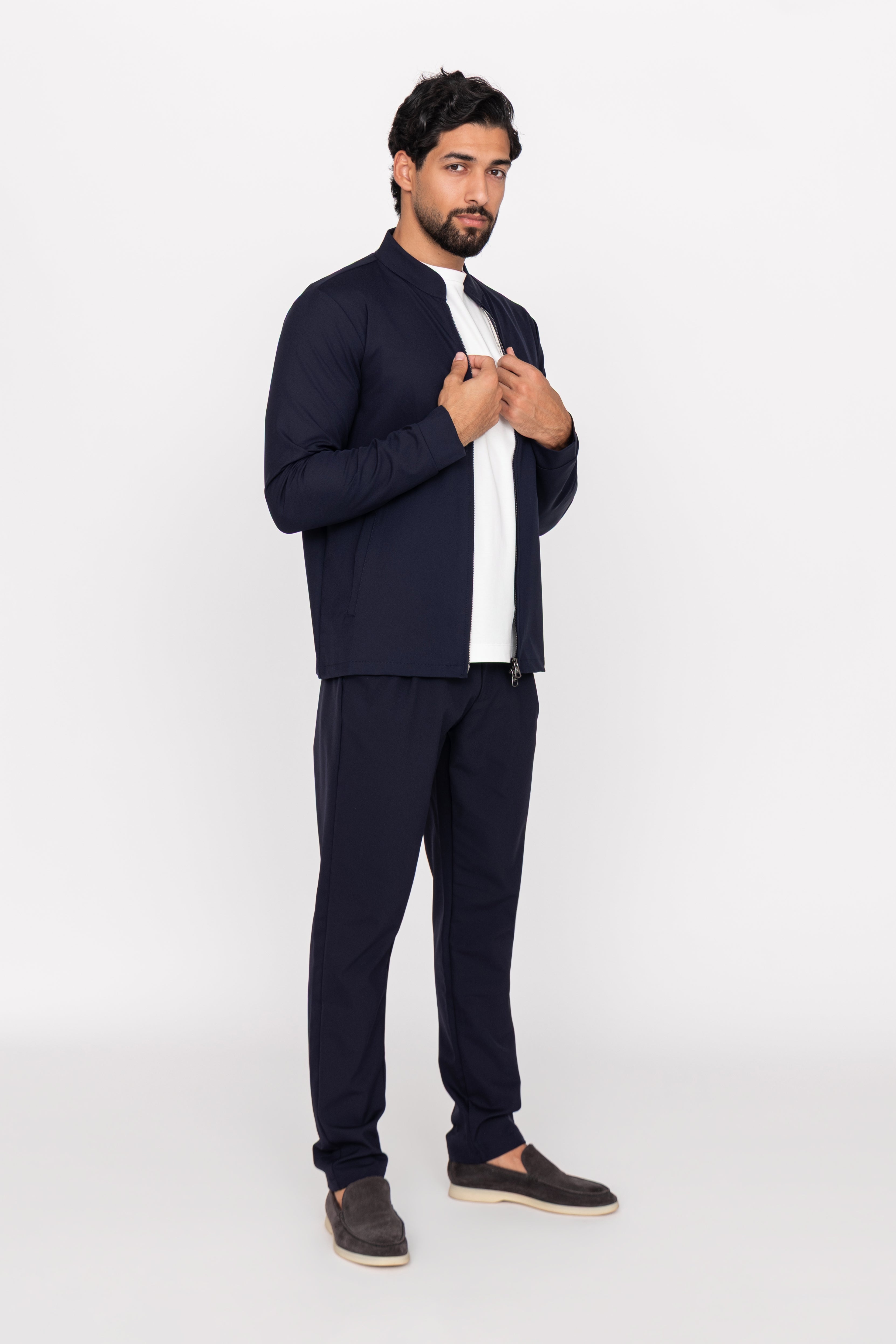 Man wearing a navy suit on a white background